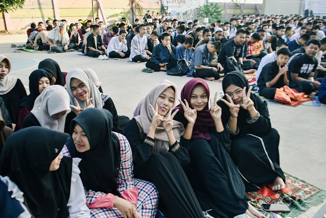 Students gather at Islamic event.